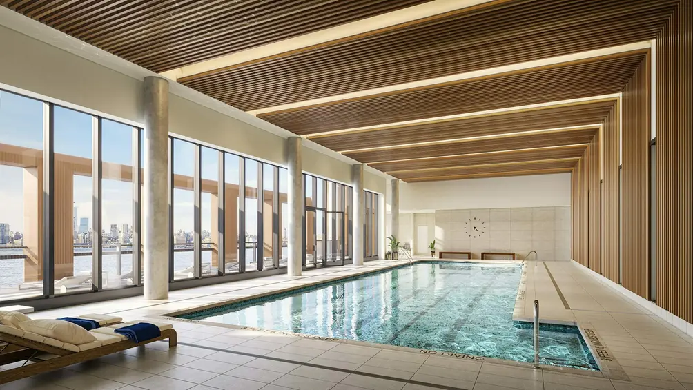 Indoor pool with floor-to-ceiling windows