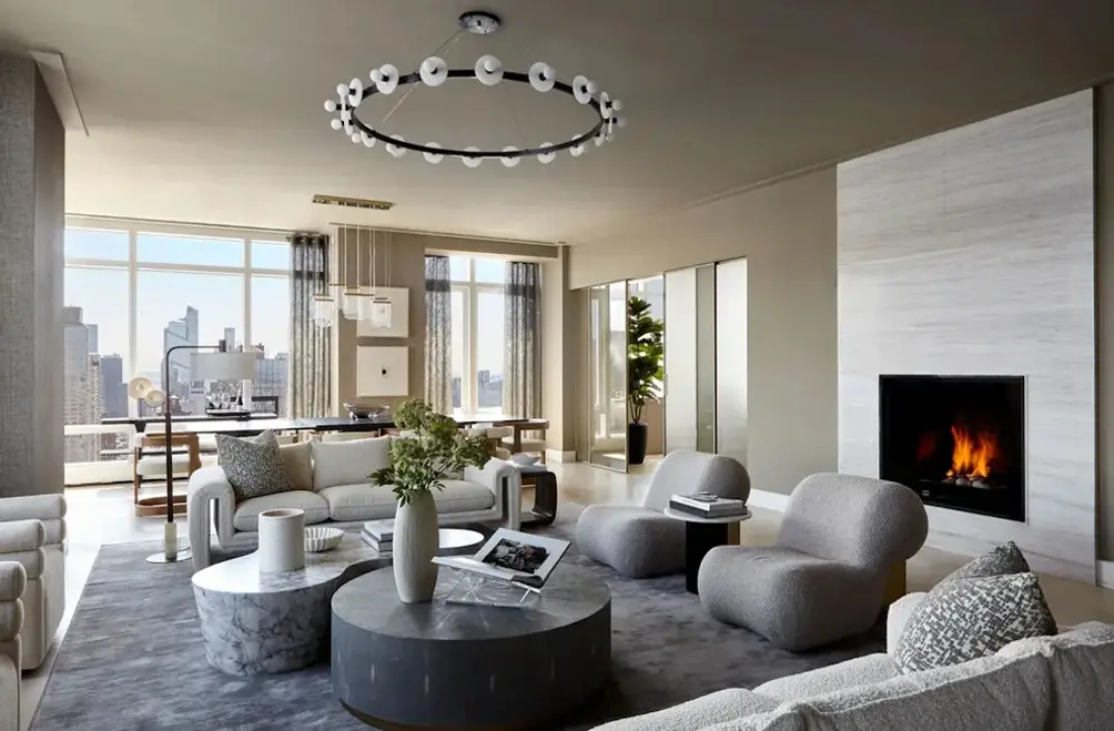 Living room with fireplace and city views