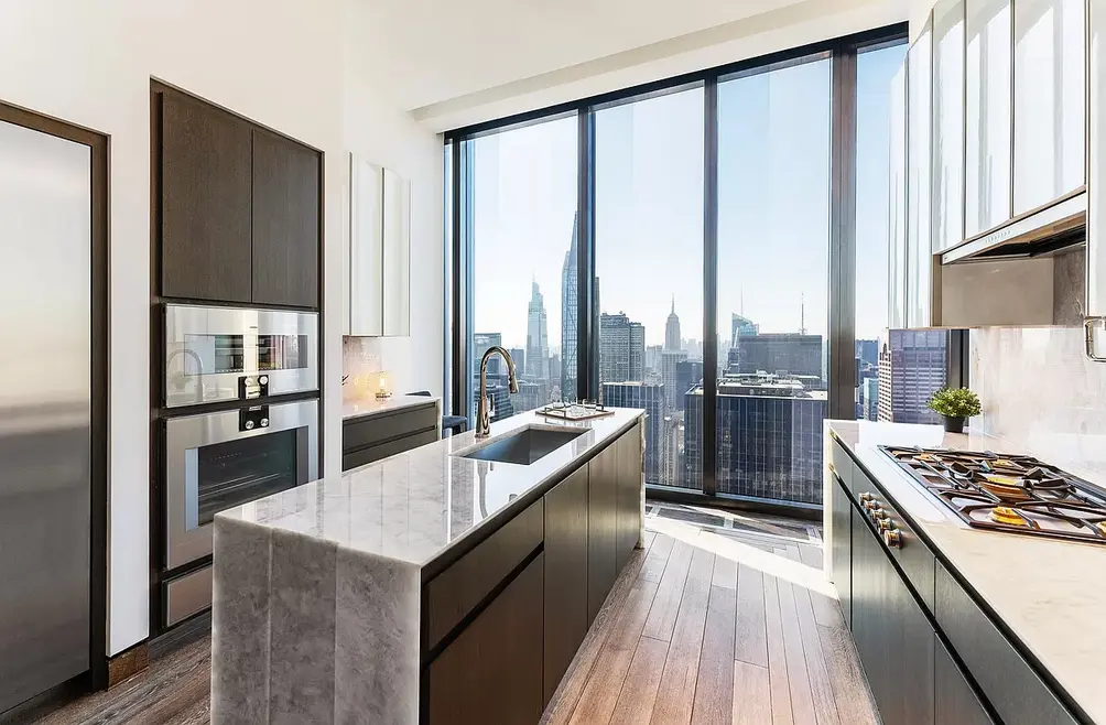 Windowed kitchen with skyline views