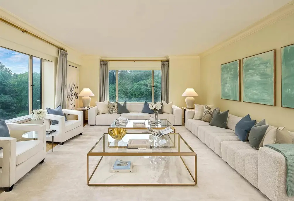 Corner living room with treetop views
