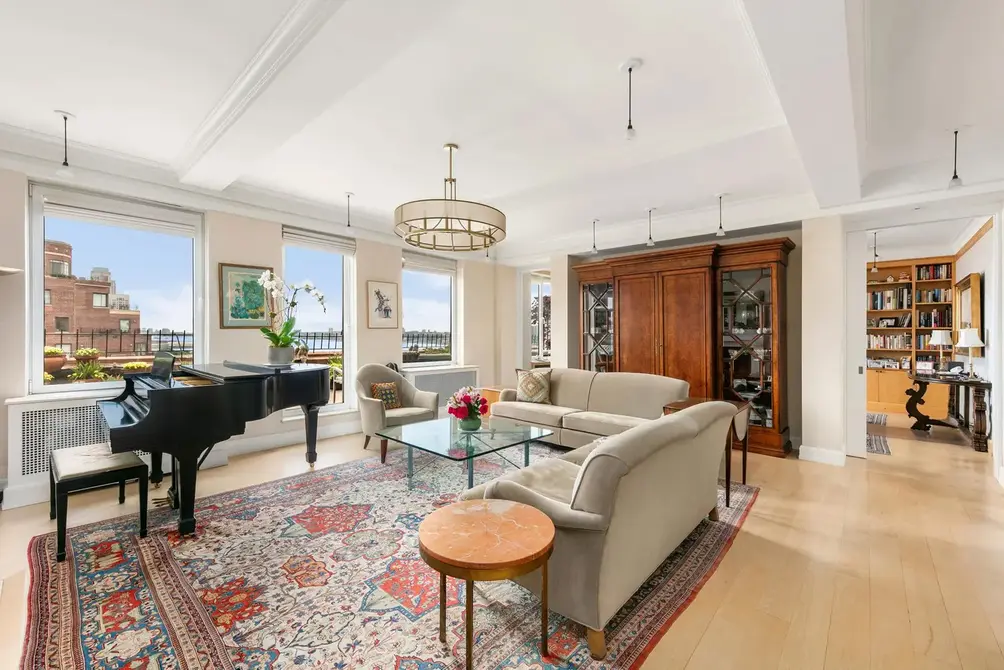 Living room with beamed ceiling and Hudson River views