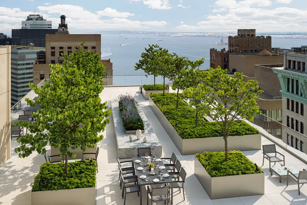 Outdoor terrace with river and Statue of Liberty views