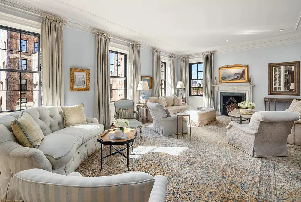 Living room with wall of windows and fireplace