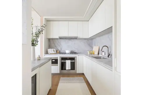 Open kitchen with white lacquer cabinetry