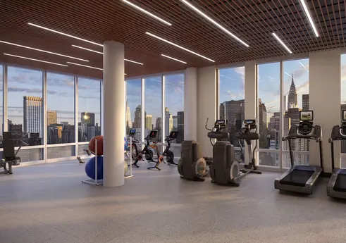 High-floor fitness center with Chrysler Building views