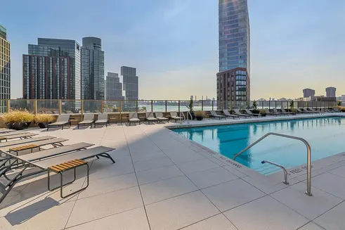 Outdoor pool with East River views