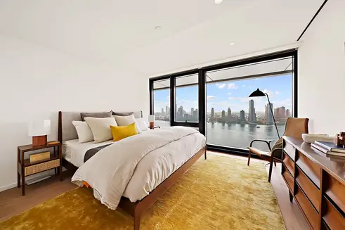 Primary bedroom with river views