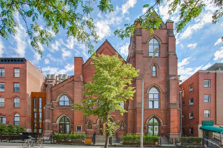 A highly coveted rental is below this beautifully restored facade. (The Spire Lofts via All Year Management LLC)