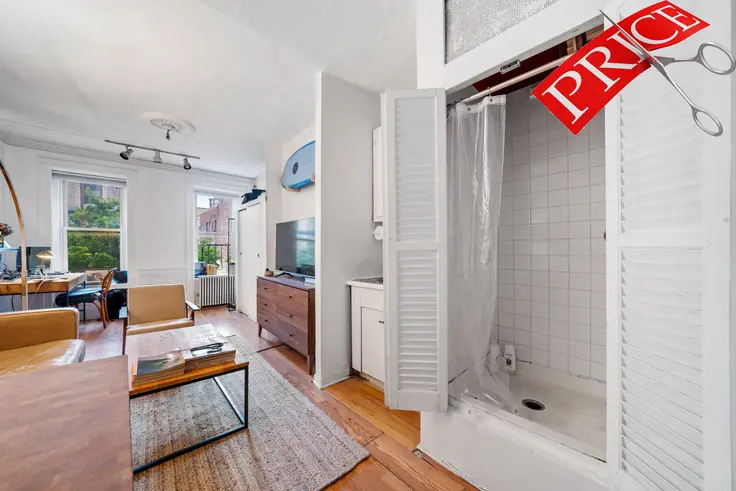 Yes, that is a shower stall in the living room! (140 West 10th Street, #5F - Compass)