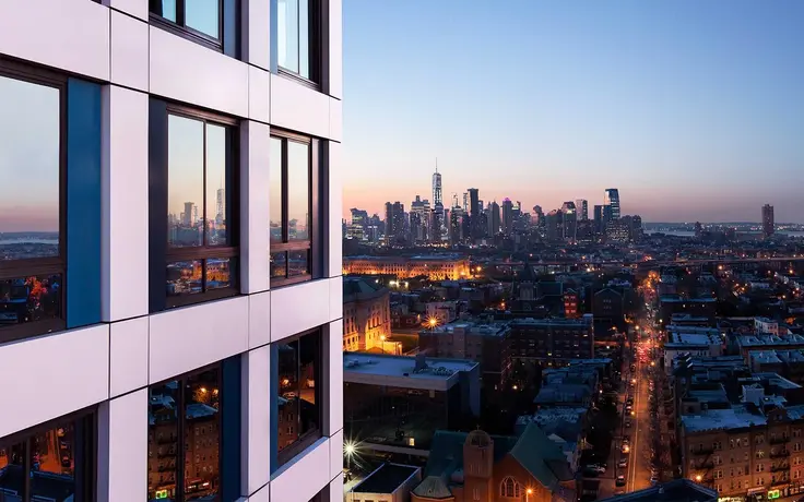 A view of the Manhattan skyline from Journal Squared, a new 53-story rental in Jersey City. (Image via journalsquared.com)