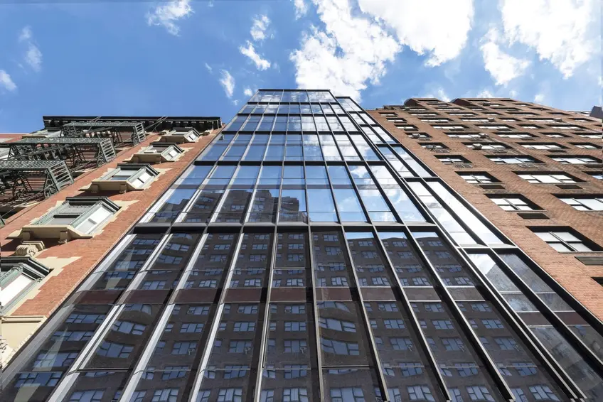 Looking up at The LES's sleek curtain wall (Modern Spaces)
