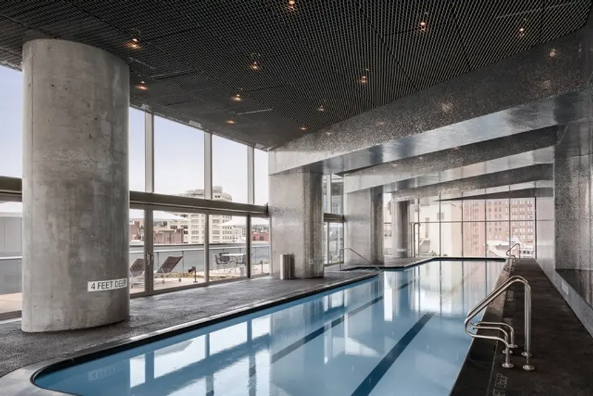 A 75-foot pool overlooks the building's massive terrace; 