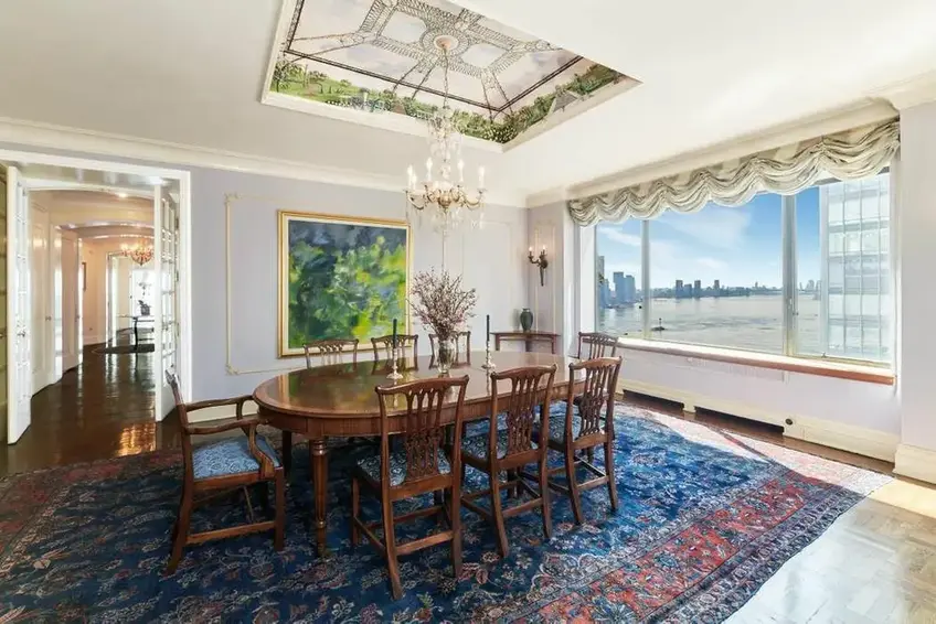 Set apart from this formal dining room, a butler's pantry allows for generous storage and prep space. (One Beekman, #15A  - Sotheby's International Realty)